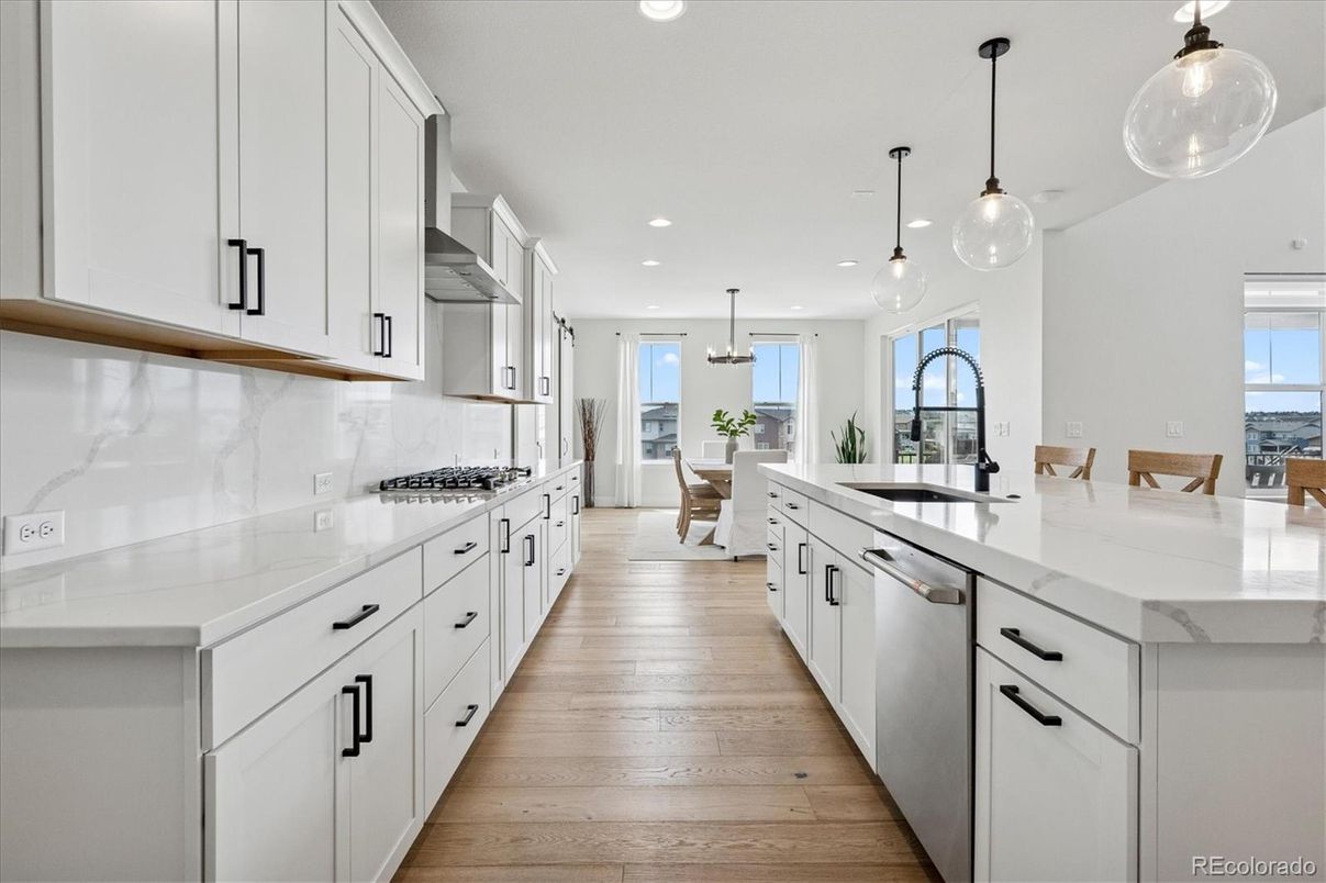 Dining room, Interior, Kitchen, Pendant Lights, Recessed Lighting, Stainless Steel Appliances, Wood Texture Flooring