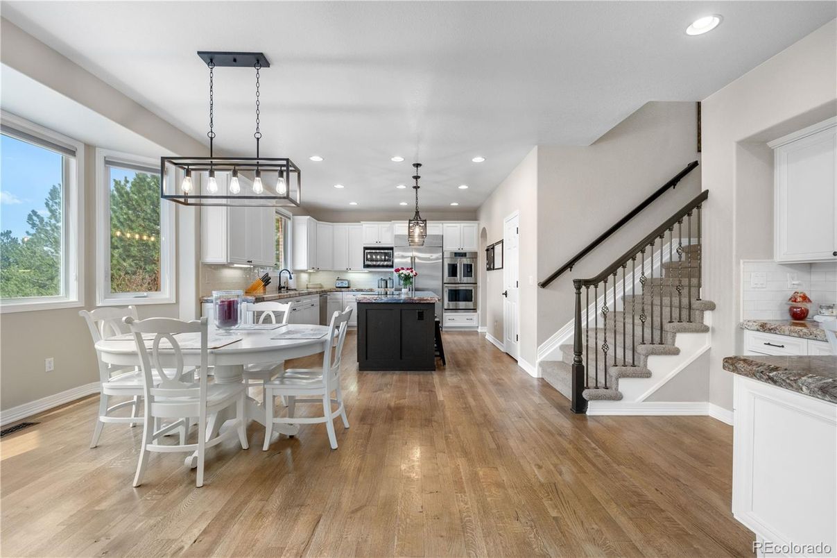 Dining room, Interior, Kitchen, Pendant Lights, Recessed Lighting, Stainless Steel Appliances, Wood Texture Flooring