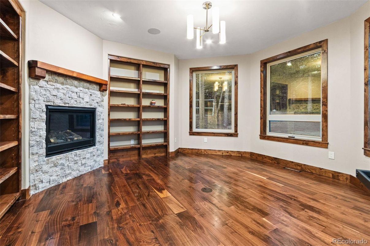 Empty room, Fireplace, Interior, Pendant Lights, Recessed Lighting, Wood Texture Flooring