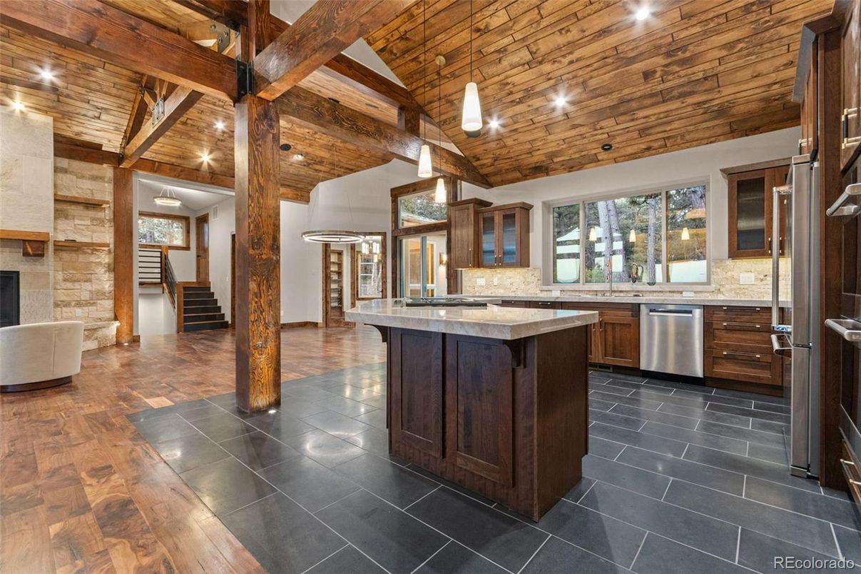Fireplace, Interior, Kitchen, Pendant Lights, Recessed Lighting, Stainless Steel Appliances, Stone Walls, Wooden Beams, Wooden Ceilings, Wood Texture Flooring