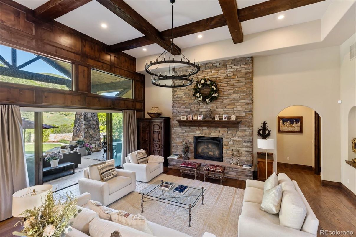 Chandelier, Fireplace, Interior, Living room, Recessed Lighting, Stone Walls, Wooden Beams, Wood Texture Flooring