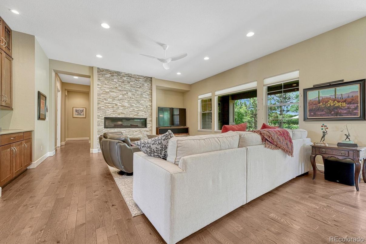 Fireplace, Interior, Living room, Recessed Lighting, Stone Walls, Wood Texture Flooring