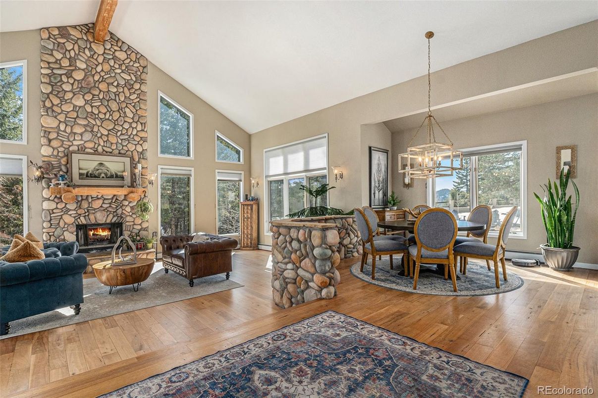 Dining room, Fireplace, Interior, Living room, Pendant Lights, Stone Walls, Wood Texture Flooring