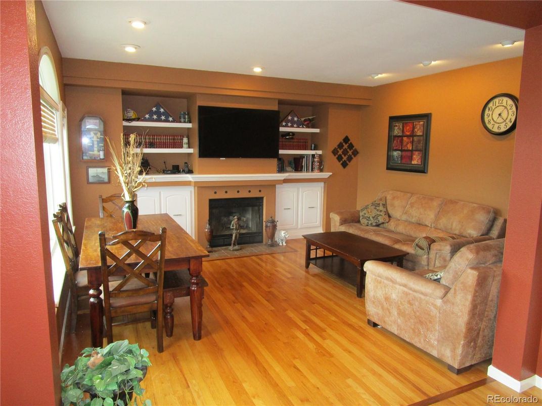 Dining room, Fireplace, Interior, Living room, Recessed Lighting, Wood Texture Flooring