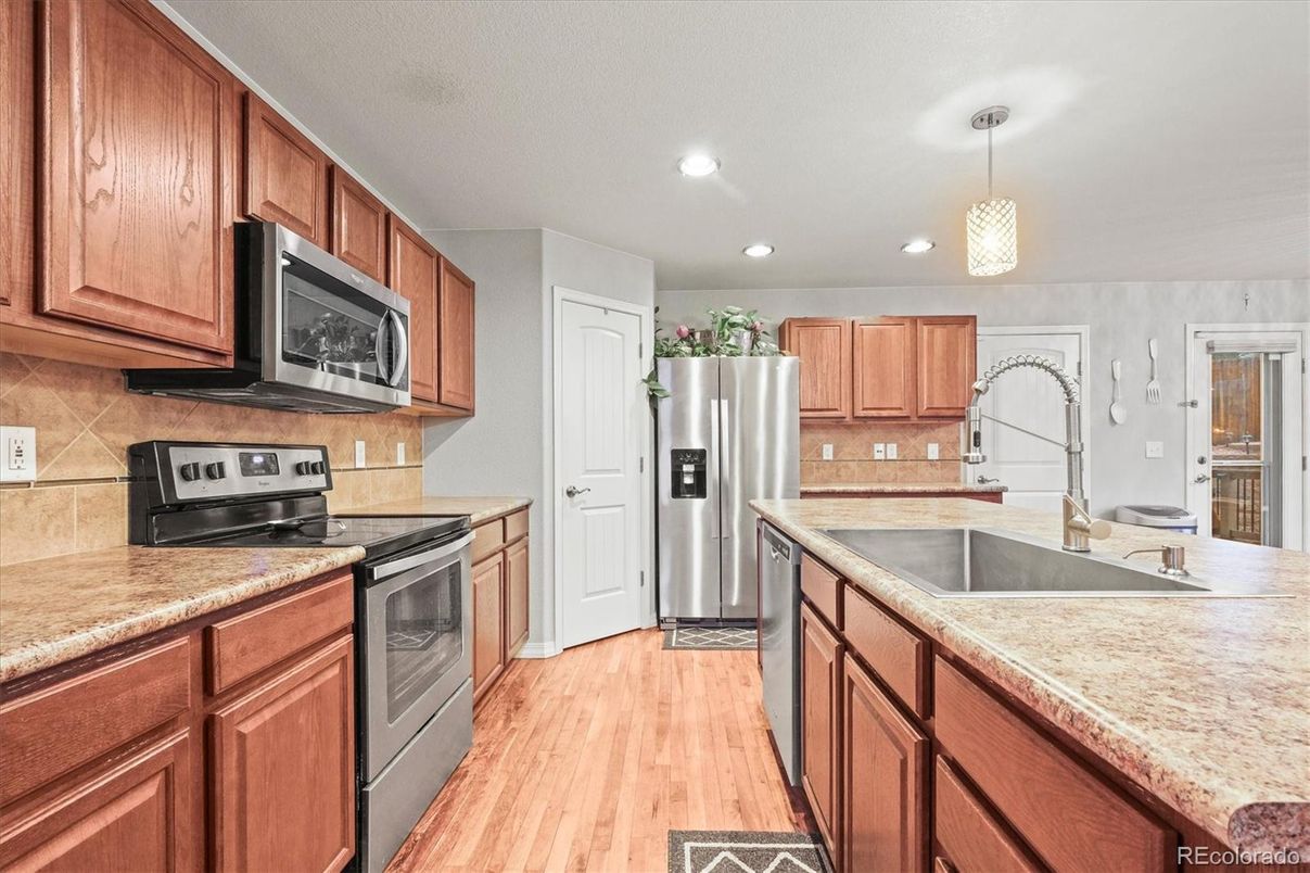 Interior, Kitchen, Pendant Lights, Recessed Lighting, Stainless Steel Appliances, Wood Texture Flooring