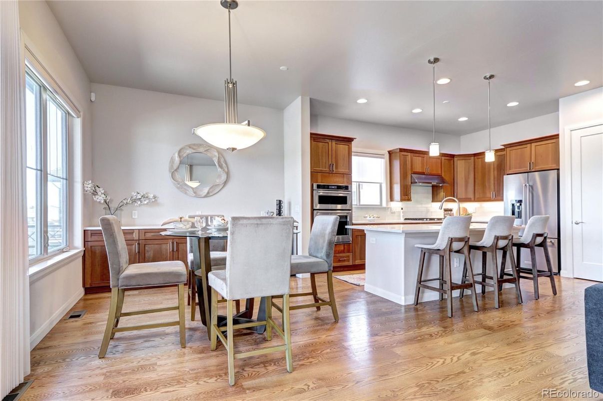 Dining room, Interior, Kitchen, Pendant Lights, Recessed Lighting, Stainless Steel Appliances, Wood Texture Flooring