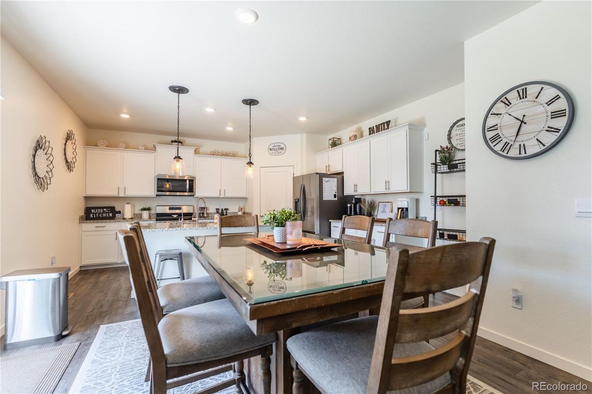 Dining room, Interior, Kitchen, Pendant Lights, Recessed Lighting, Stainless Steel Appliances, Wood Texture Flooring
