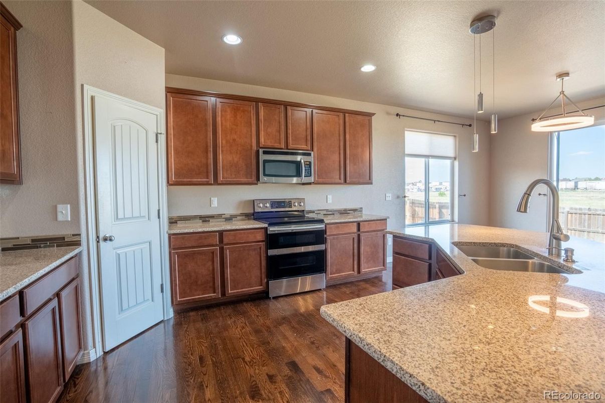 Interior, Kitchen, Pendant Lights, Recessed Lighting, Stainless Steel Appliances, Wood Texture Flooring
