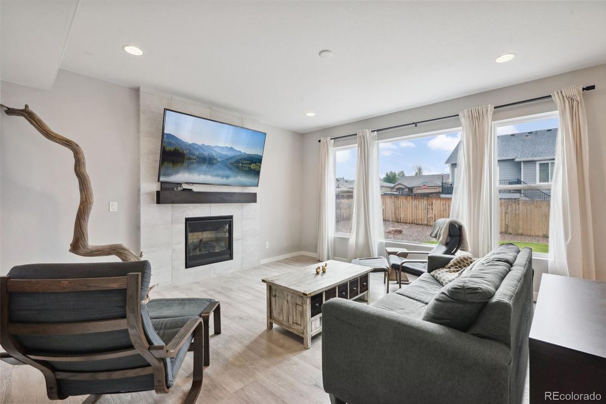Fireplace, Interior, Living room, Recessed Lighting, Wood Texture Flooring