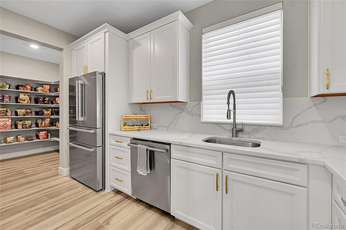 Interior, Kitchen, Marble Walls, Recessed Lighting, Stainless Steel Appliances, Wood Texture Flooring