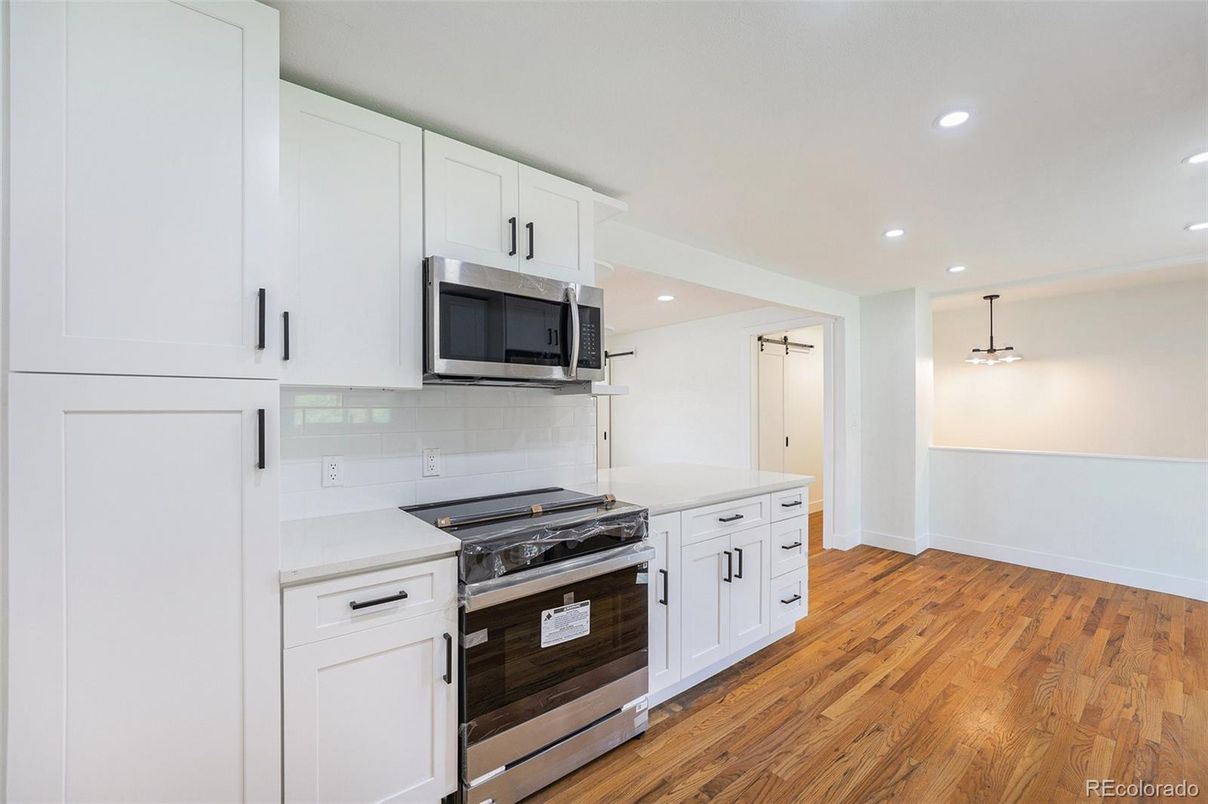 Interior, Kitchen, Pendant Lights, Recessed Lighting, Stainless Steel Appliances, Wood Texture Flooring