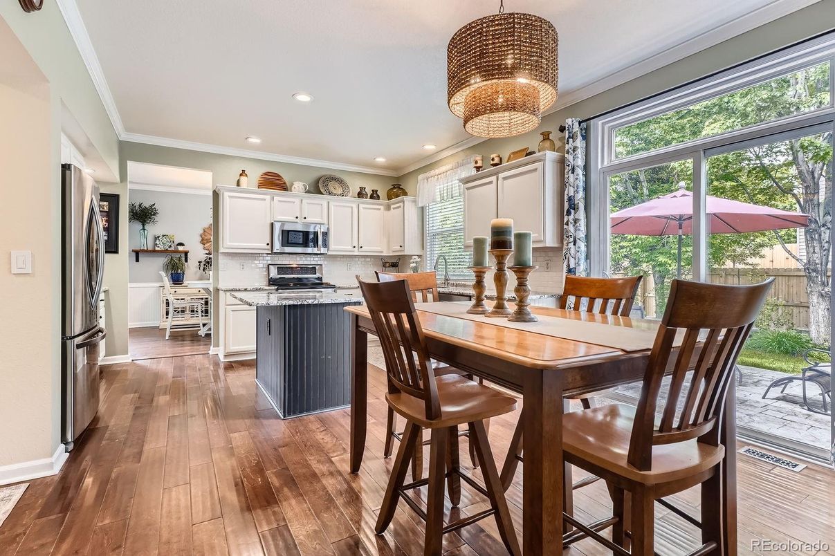Chandelier, Dining room, Interior, Kitchen, Recessed Lighting, Stainless Steel Appliances, Wood Texture Flooring