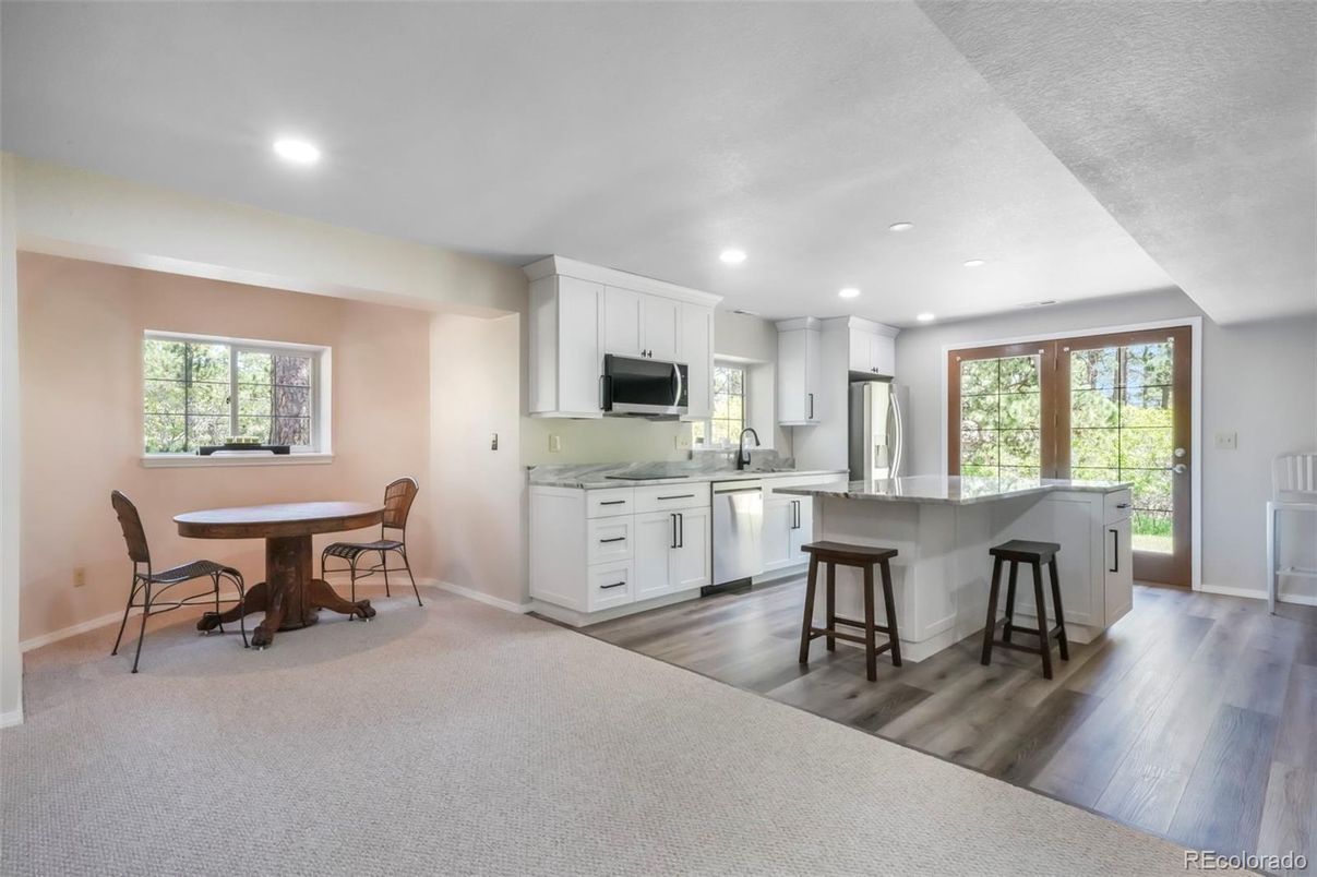 Dining room, Interior, Kitchen, Recessed Lighting, Stainless Steel Appliances, Wood Texture Flooring