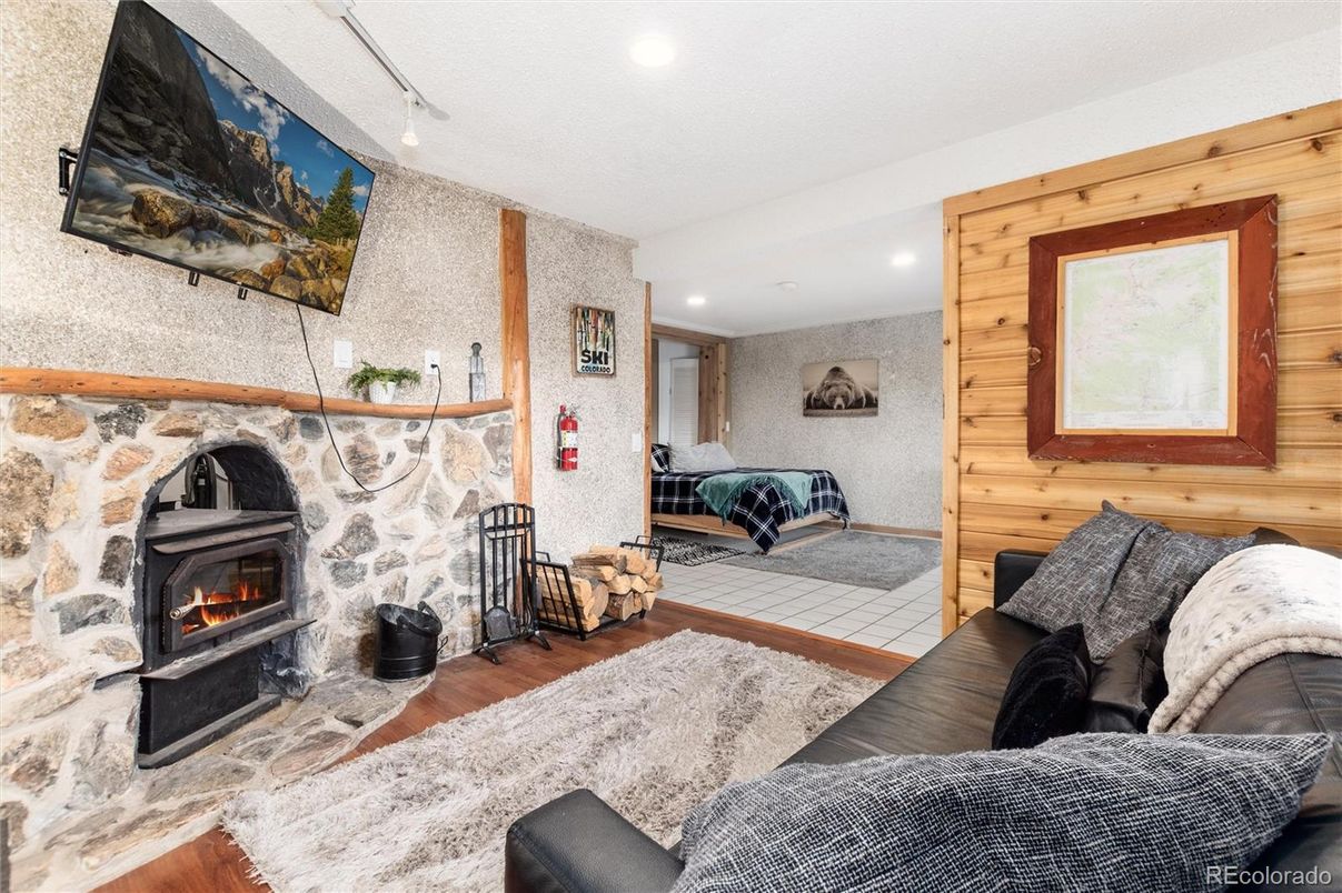 Fireplace, Interior, Living room, Recessed Lighting, Wood Texture Flooring, Wooden Walls