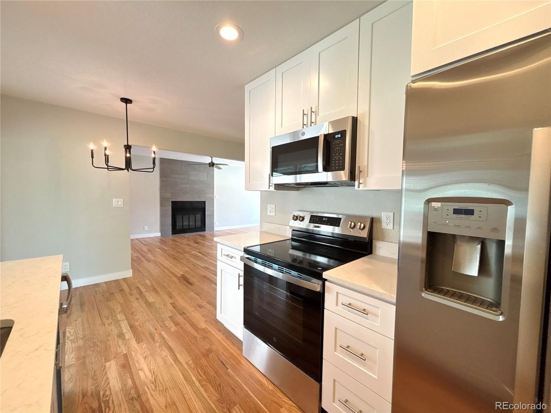 Chandelier, Fireplace, Interior, Kitchen, Pendant Lights, Recessed Lighting, Wood Texture Flooring