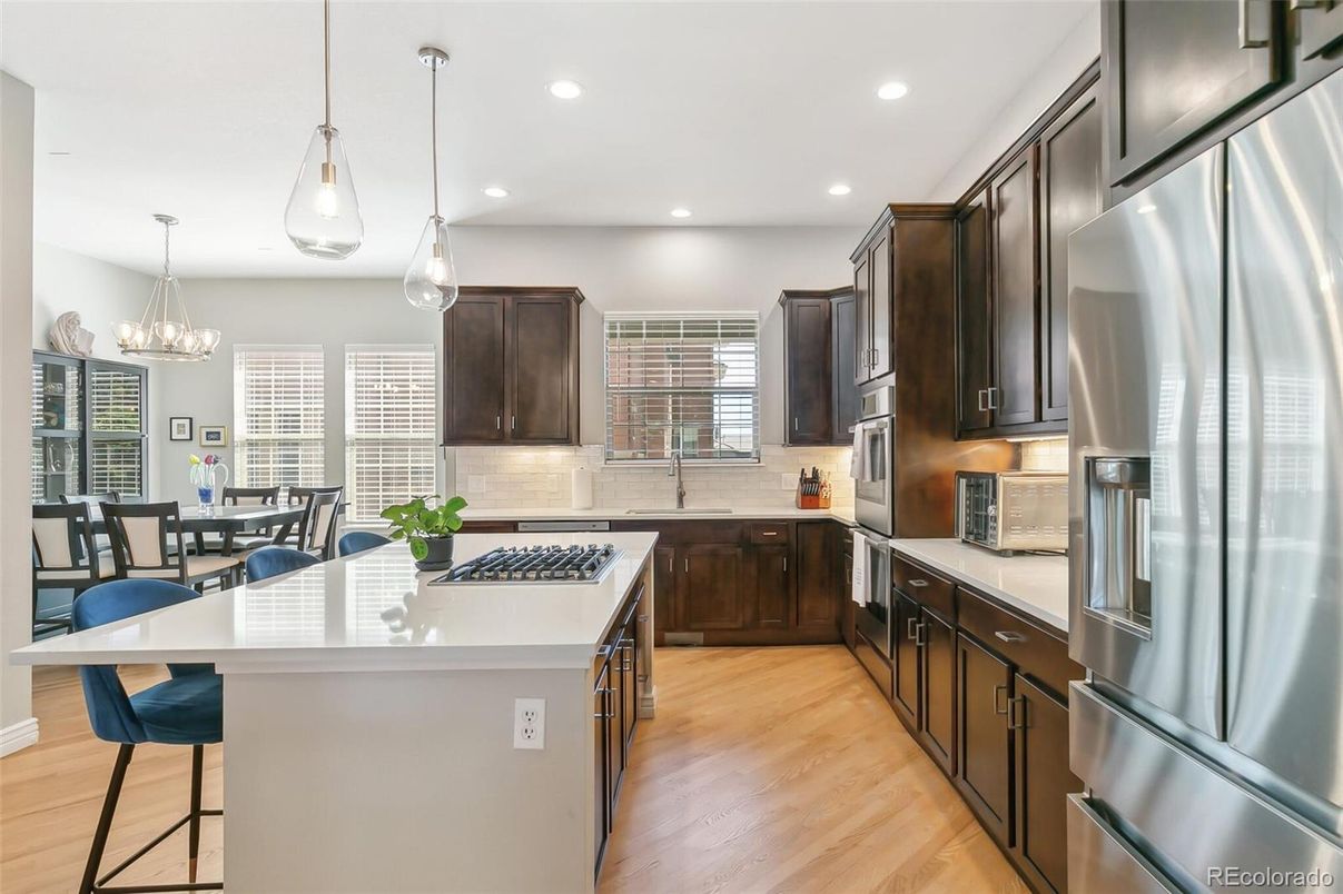 Chandelier, Dining room, Interior, Kitchen, Pendant Lights, Recessed Lighting, Stainless Steel Appliances, Wood Texture Flooring