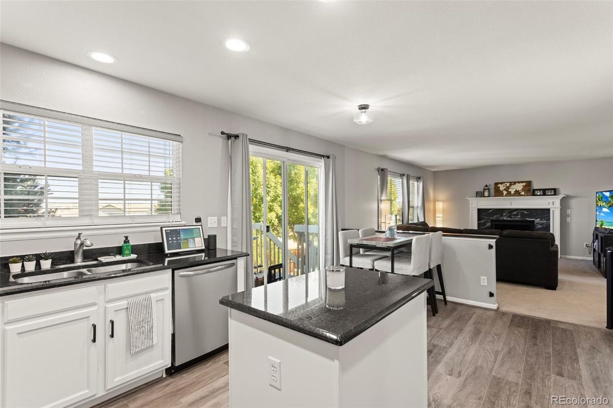Dining room, Fireplace, Interior, Kitchen, Living room, Recessed Lighting, Wood Texture Flooring
