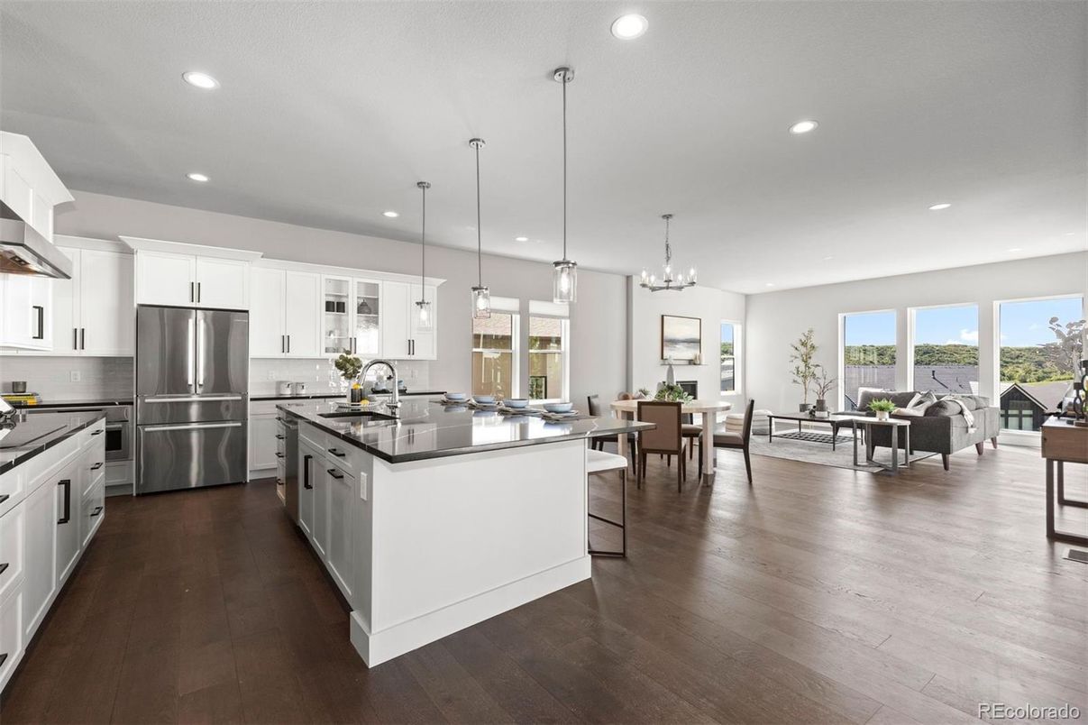 Chandelier, Dining room, Interior, Kitchen, Pendant Lights, Recessed Lighting, Stainless Steel Appliances, Wood Texture Flooring