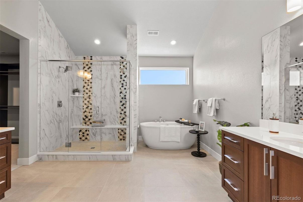 Bathroom, Dual Sink Vanities, Free Standing Baths, Glass Shower, Interior, Marble Walls, Recessed Lighting