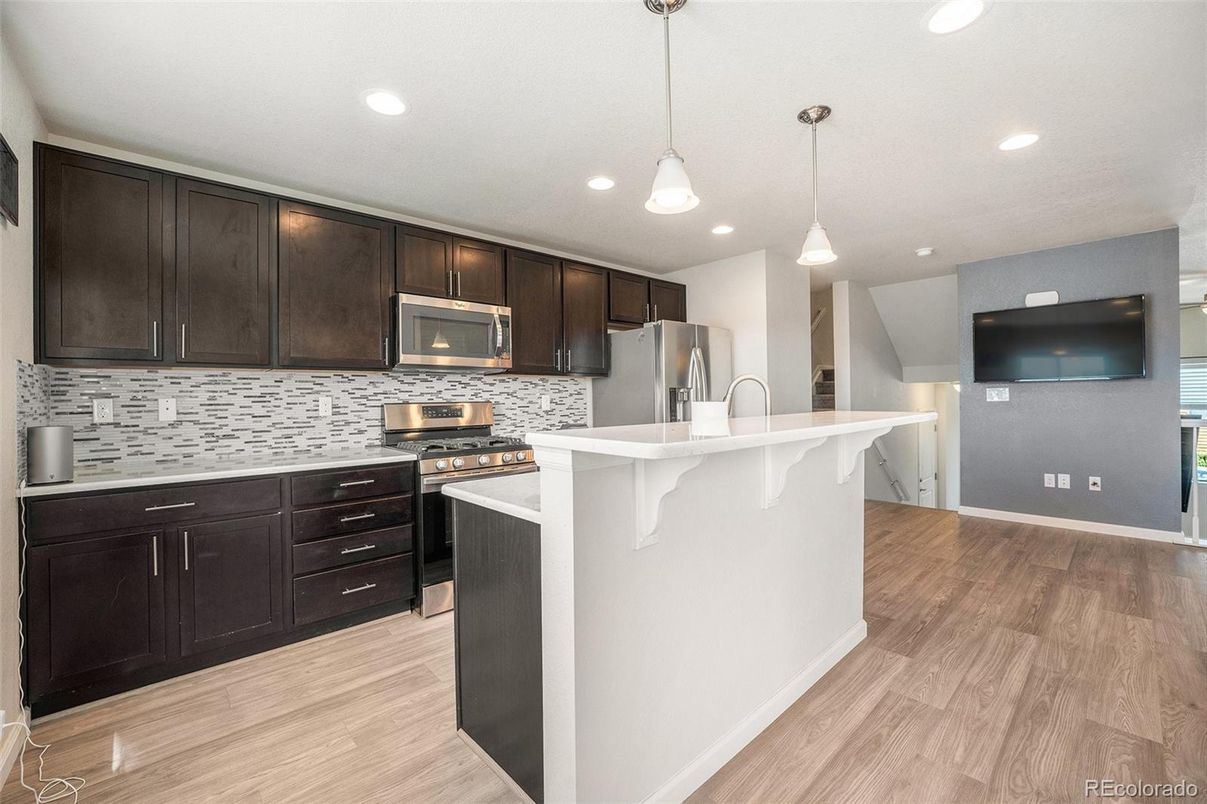 Interior, Kitchen, Pendant Lights, Recessed Lighting, Stainless Steel Appliances, Wood Texture Flooring