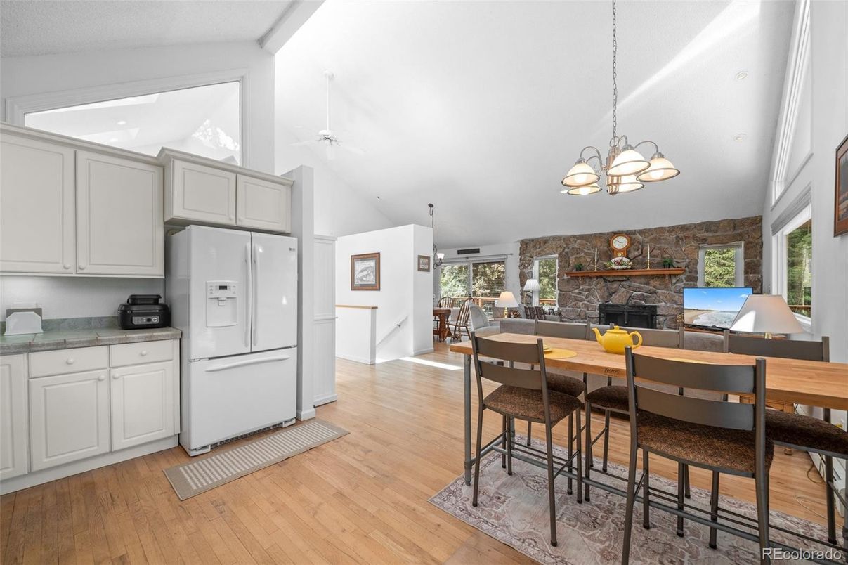 Dining room, Fireplace, Interior, Kitchen, Pendant Lights, Stone Walls, Wood Texture Flooring