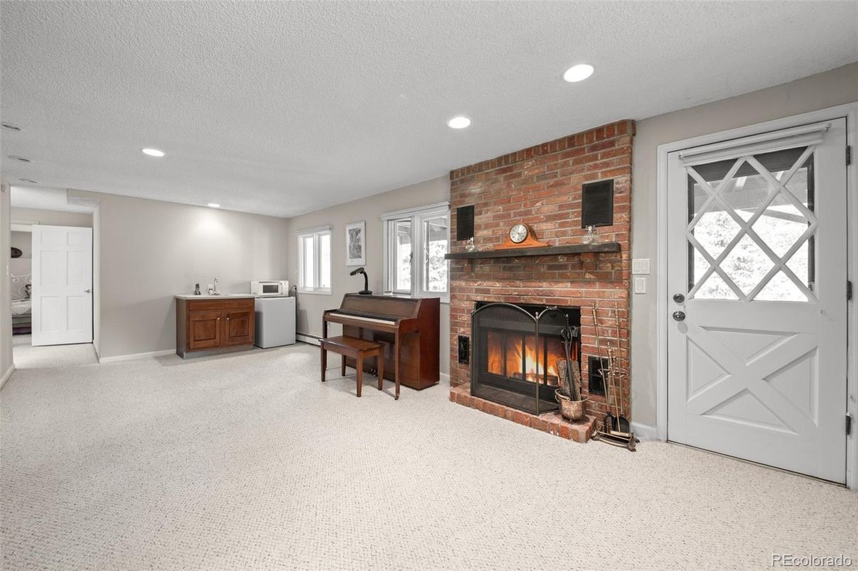 Fireplace, Interior, Piano, Recessed Lighting, Stone Walls