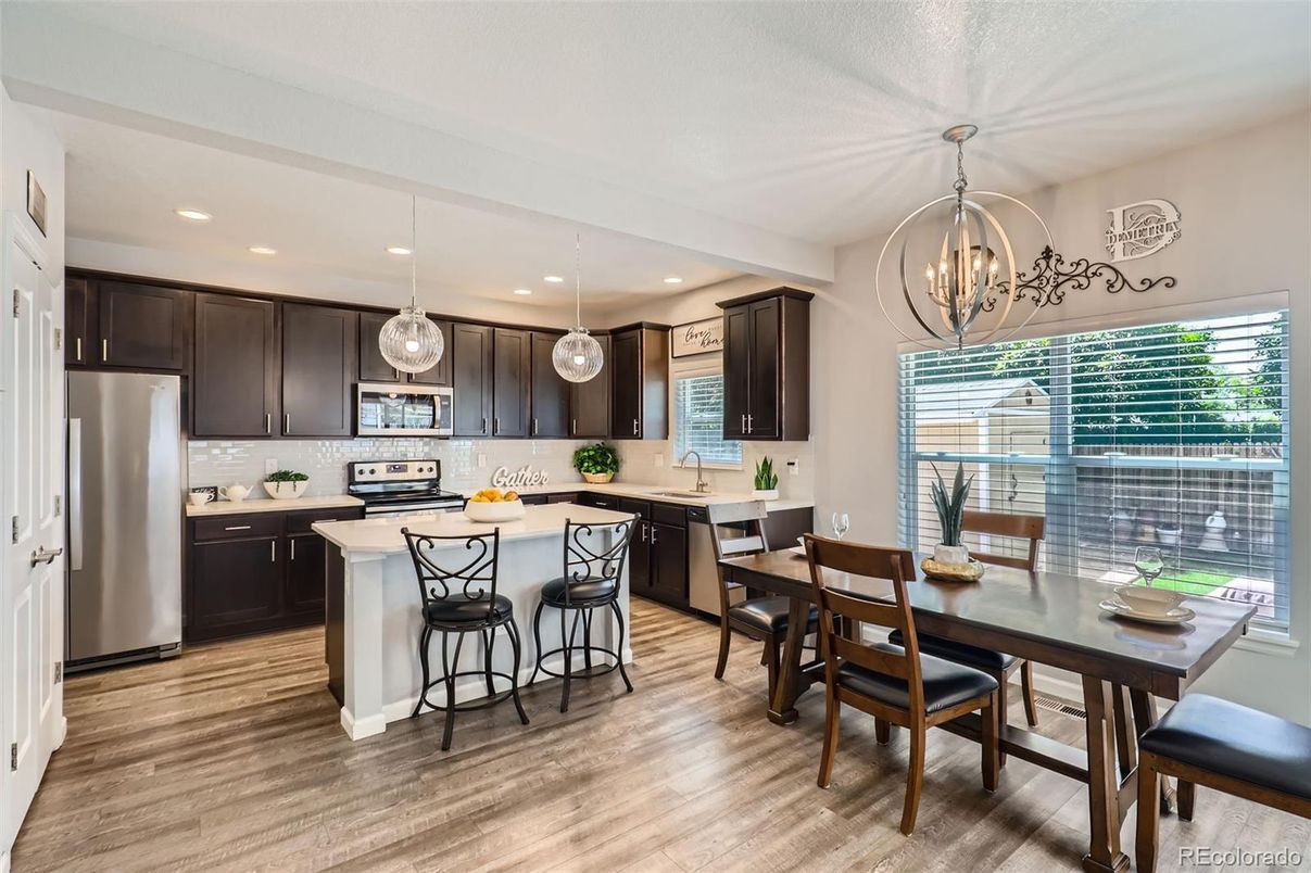 Chandelier, Dining room, Interior, Kitchen, Pendant Lights, Recessed Lighting, Stainless Steel Appliances, Wood Texture Flooring