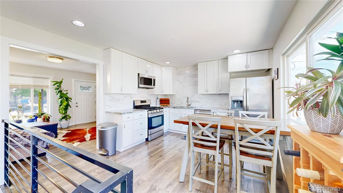 Dining room, Interior, Kitchen, Marble Walls, Recessed Lighting, Stainless Steel Appliances, Wood Texture Flooring