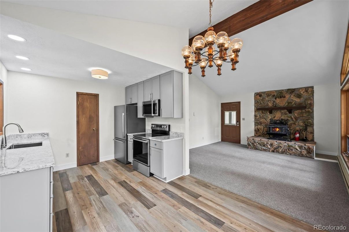 Fireplace, Interior, Kitchen, Pendant Lights, Recessed Lighting, Stainless Steel Appliances, Wood Texture Flooring