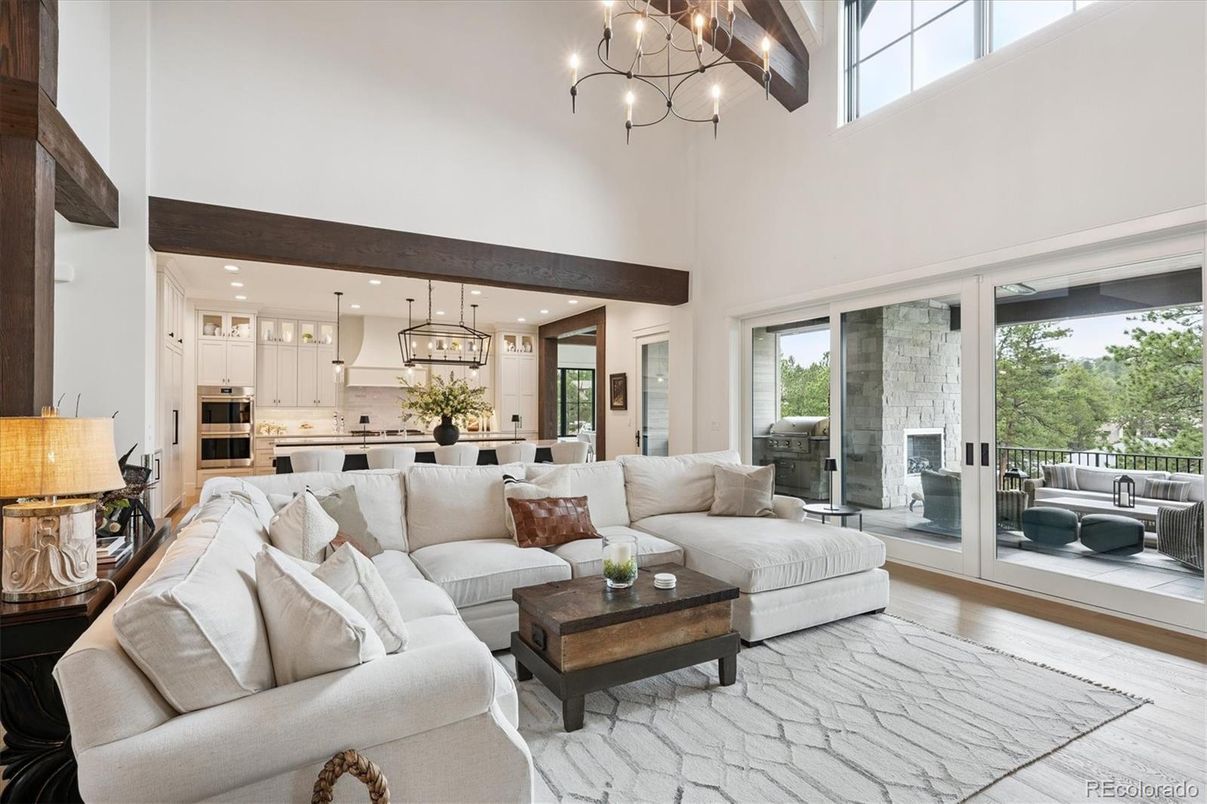 Chandelier, Interior, Kitchen, Living room, Pendant Lights, Recessed Lighting, Stainless Steel Appliances, Wooden Beams, Wood Texture Flooring