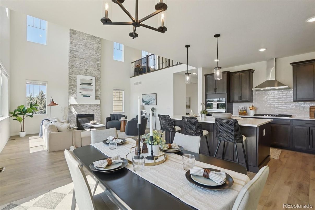 Dining room, Fireplace, Interior, Kitchen, Living room, Pendant Lights, Recessed Lighting, Stainless Steel Appliances, Stone Walls, Wood Texture Flooring