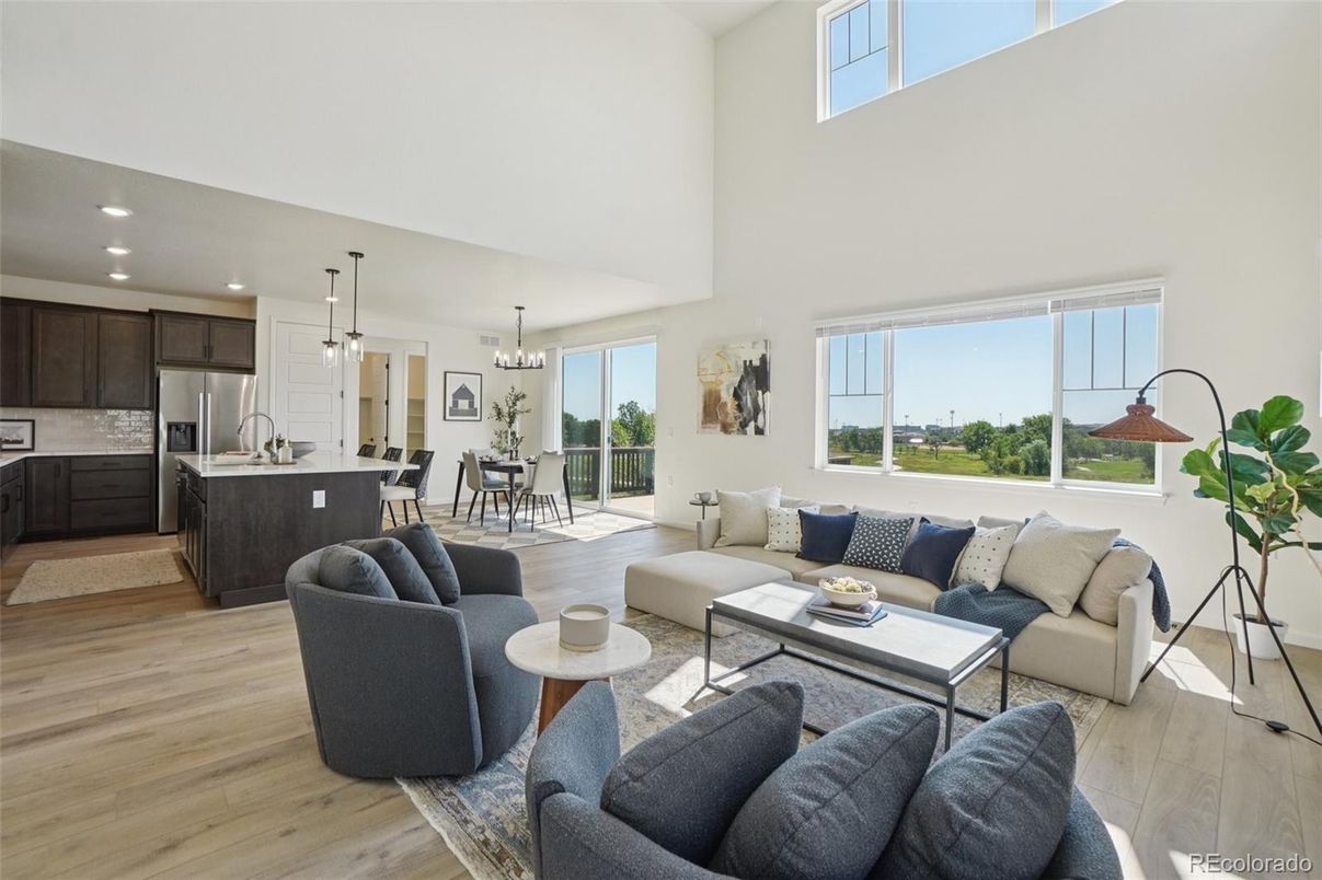 Chandelier, Dining room, Interior, Kitchen, Living room, Pendant Lights, Recessed Lighting, Stainless Steel Appliances, Wood Texture Flooring