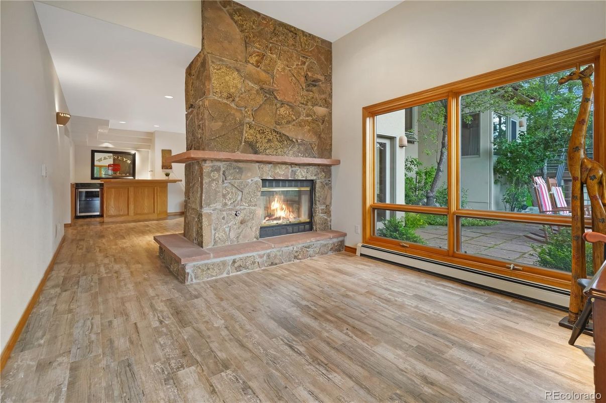 Fireplace, Interior, Recessed Lighting, Stone Walls, Wood Texture Flooring