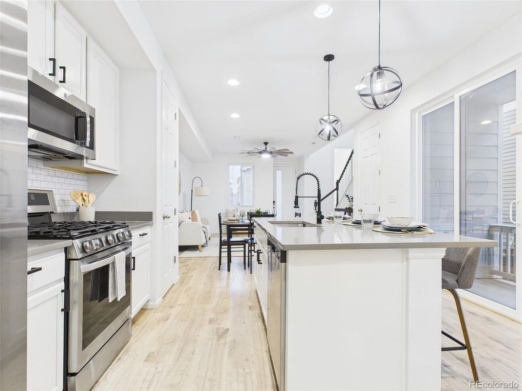Dining room, Interior, Kitchen, Pendant Lights, Recessed Lighting, Stainless Steel Appliances, Wood Texture Flooring