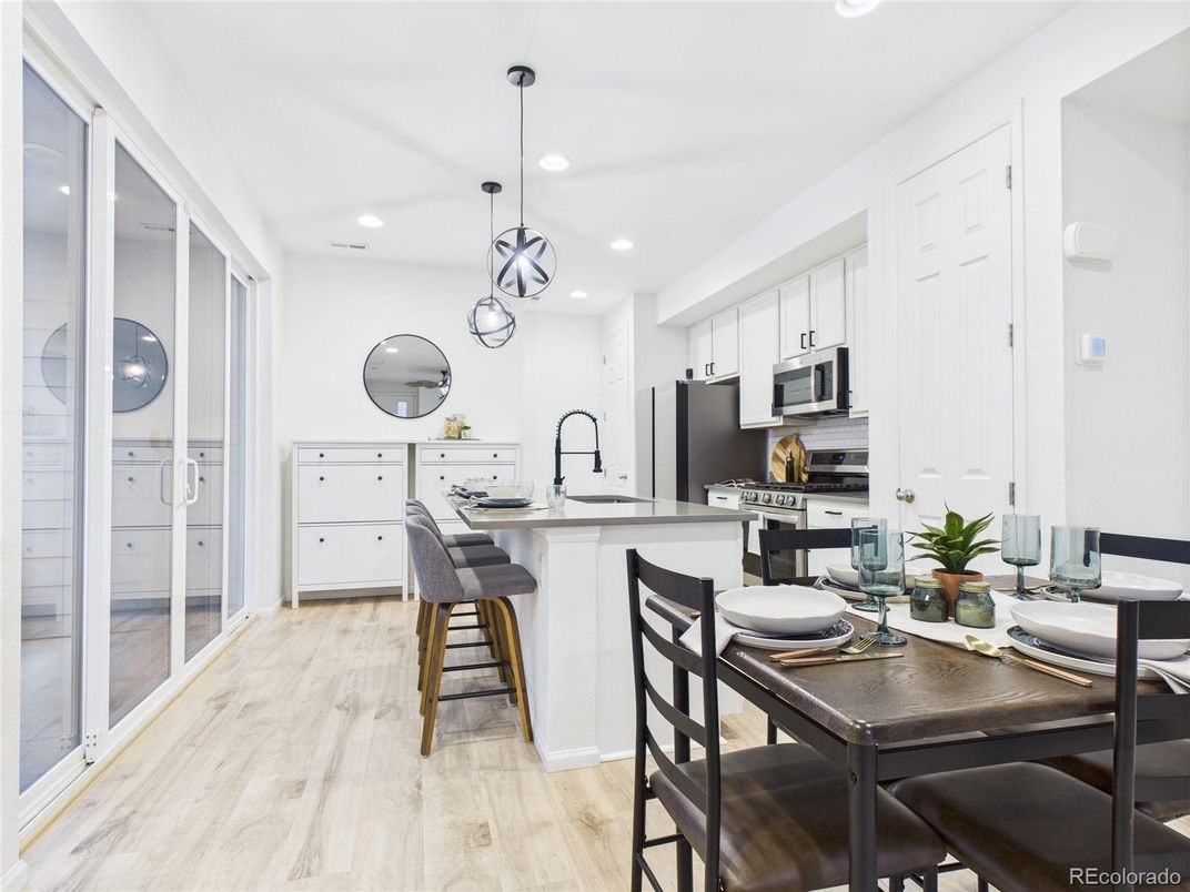 Dining room, Interior, Kitchen, Pendant Lights, Recessed Lighting, Stainless Steel Appliances, Wood Texture Flooring