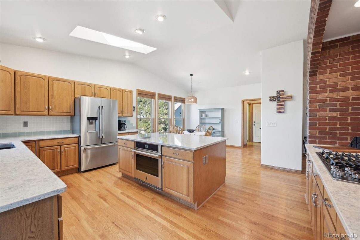 Interior, Kitchen, Pendant Lights, Recessed Lighting, Stainless Steel Appliances, Stone Walls, Wood Texture Flooring