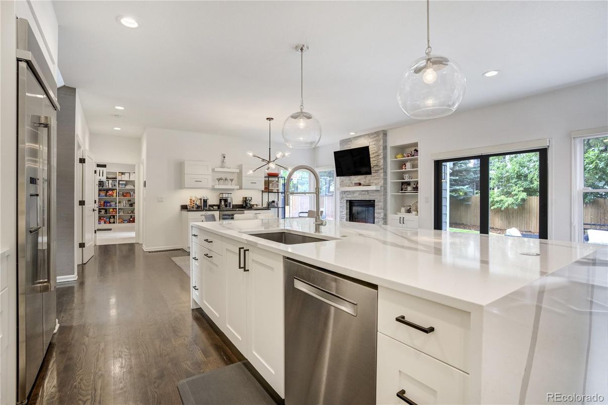 Fireplace, Interior, Kitchen, Pendant Lights, Recessed Lighting, Stainless Steel Appliances, Wood Texture Flooring
