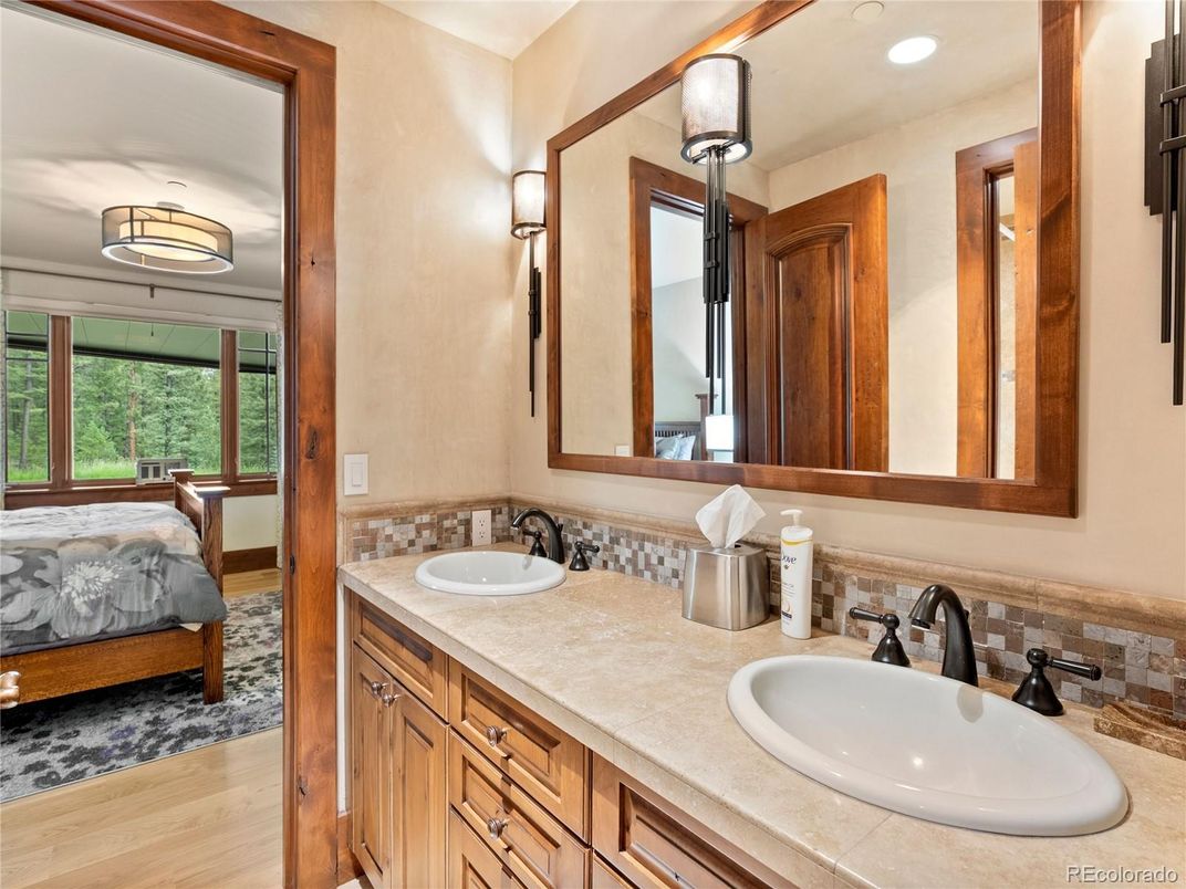 Bathroom, Dual Sink Vanities, Interior, Recessed Lighting, Tile Countertops, Wood Texture Flooring