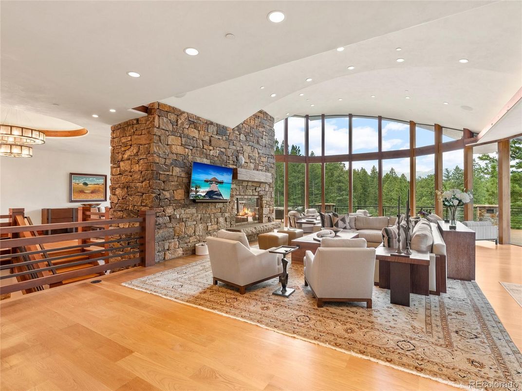 Fireplace, Interior, Living room, Recessed Lighting, Stone Walls, Wood Texture Flooring