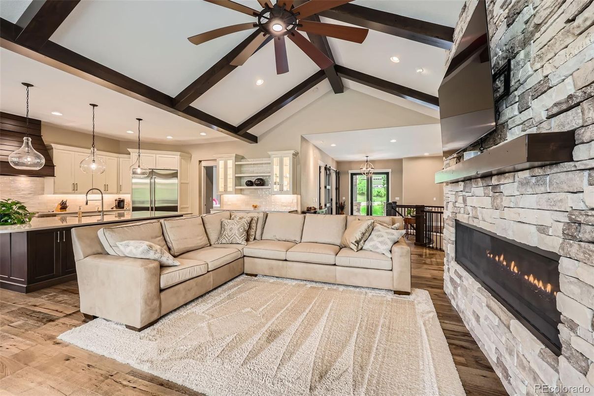 Fireplace, Interior, Kitchen, Living room, Pendant Lights, Recessed Lighting, Stainless Steel Appliances, Stone Walls, Wooden Beams, Wood Texture Flooring