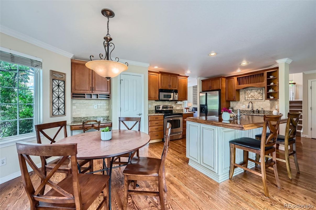 Dining room, Interior, Kitchen, Pendant Lights, Recessed Lighting, Stainless Steel Appliances, Wood Texture Flooring