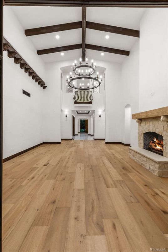 Chandelier, Fireplace, Interior, Recessed Lighting, Wooden Beams, Wood Texture Flooring