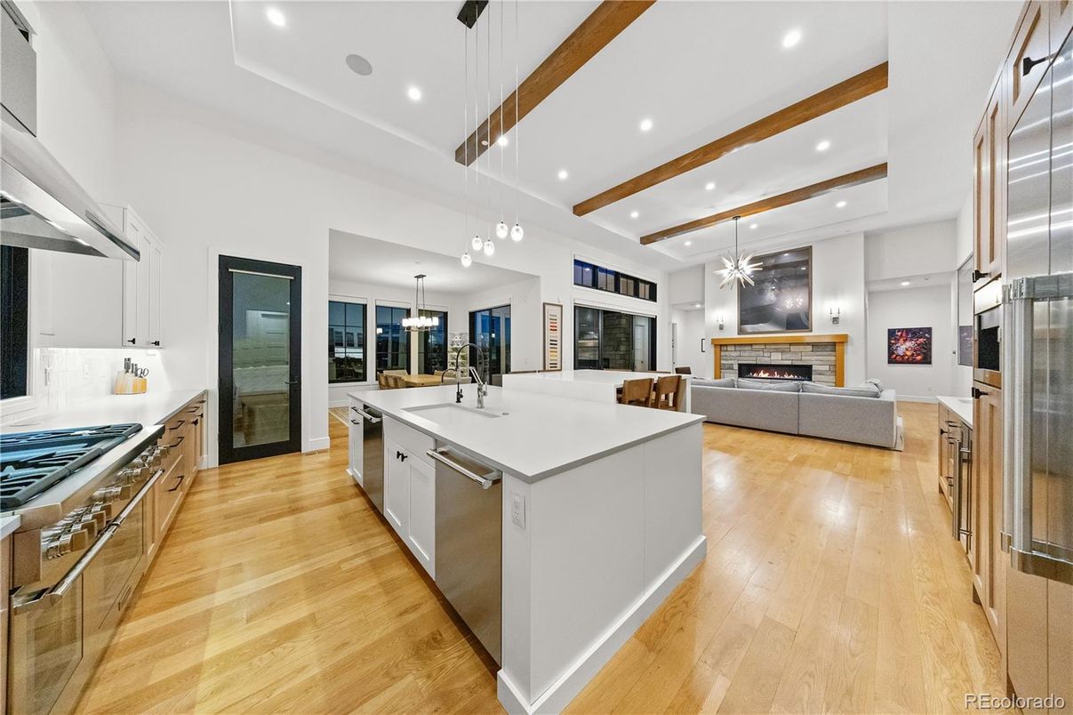 Fireplace, Interior, Kitchen, Living room, Pendant Lights, Recessed Lighting, Stainless Steel Appliances, Wooden Beams, Wood Texture Flooring