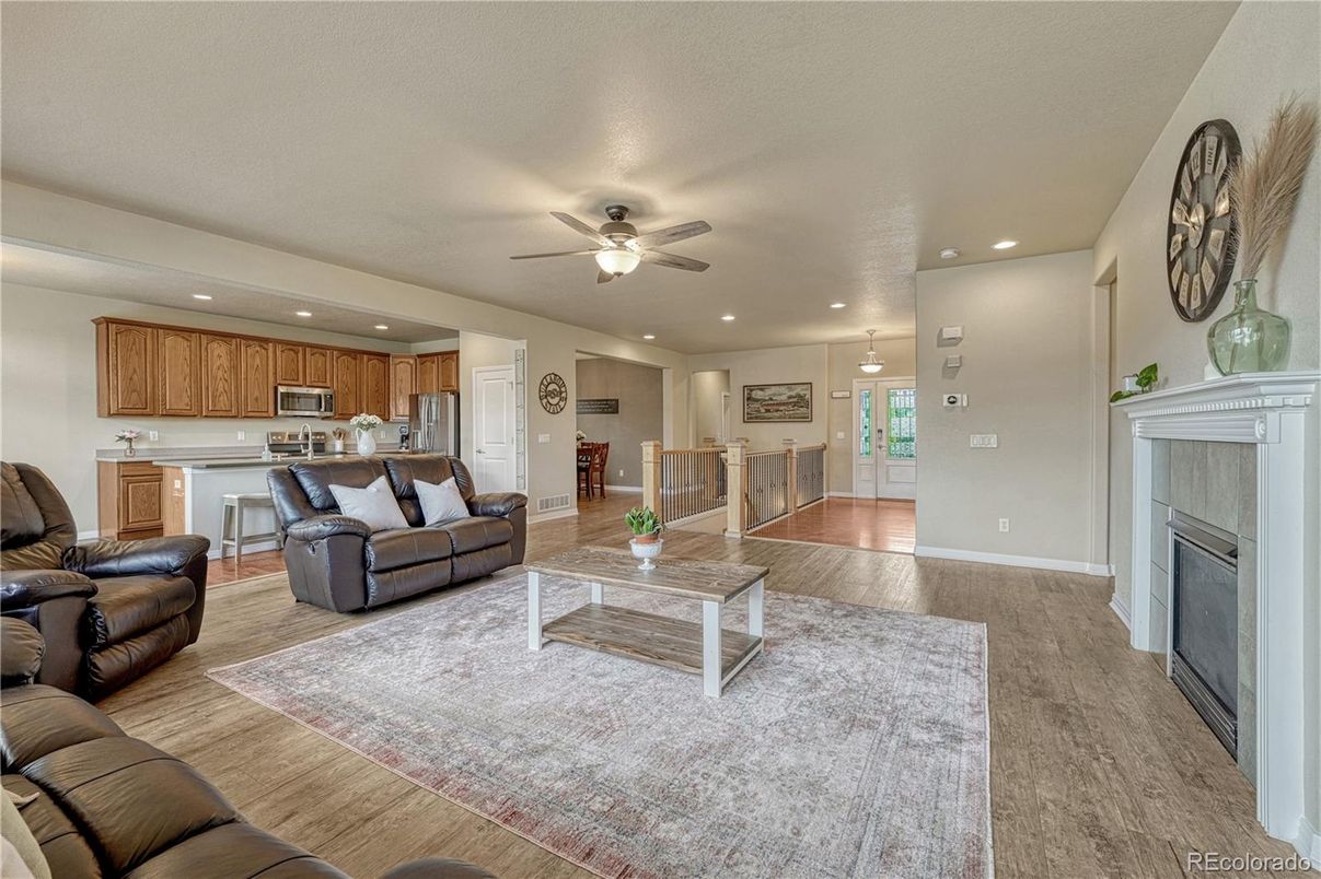 Fireplace, Interior, Kitchen, Living room, Pendant Lights, Recessed Lighting, Stainless Steel Appliances, Wood Texture Flooring