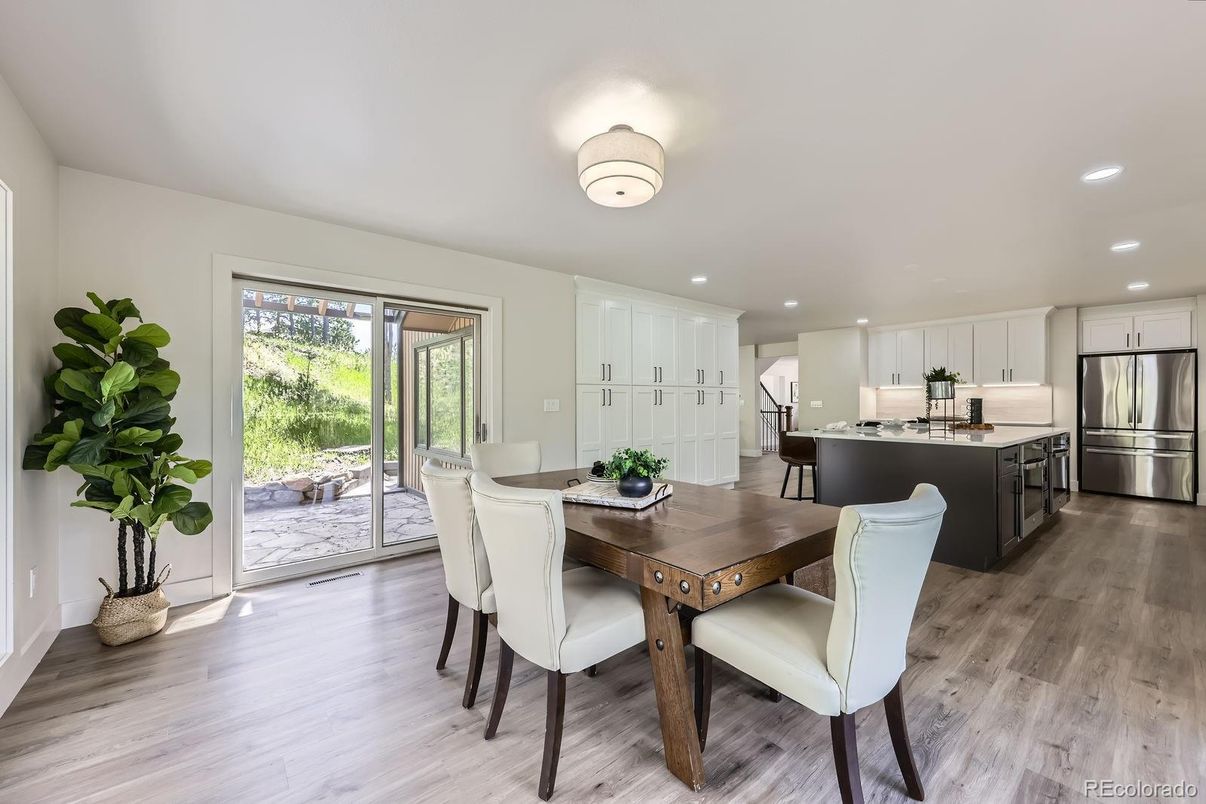 Dining room, Interior, Kitchen, Recessed Lighting, Stainless Steel Appliances, Wood Texture Flooring