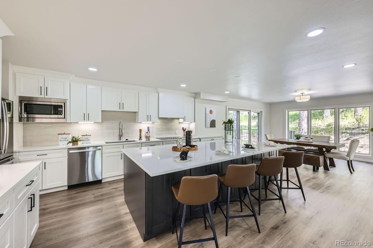 Dining room, Interior, Kitchen, Recessed Lighting, Stainless Steel Appliances, Wood Texture Flooring