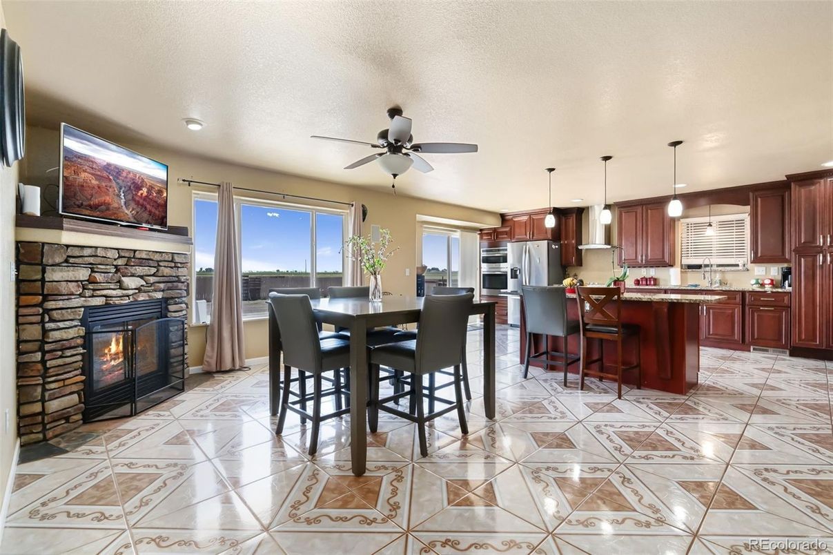 Dining room, Fireplace, Interior, Kitchen, Pendant Lights, Recessed Lighting, Stainless Steel Appliances