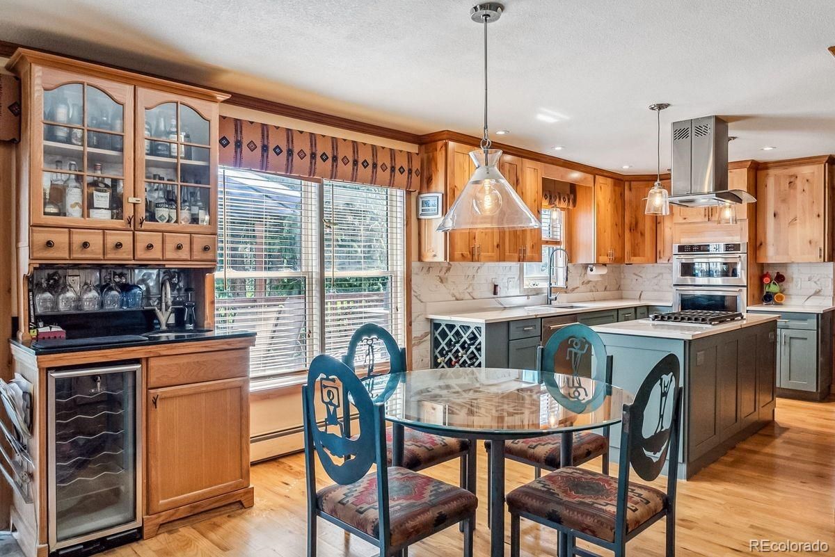 Dining room, Interior, Kitchen, Pendant Lights, Recessed Lighting, Stainless Steel Appliances, Wood Texture Flooring