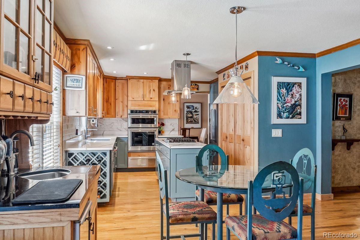 Dining room, Interior, Kitchen, Pendant Lights, Recessed Lighting, Stainless Steel Appliances, Wood Texture Flooring