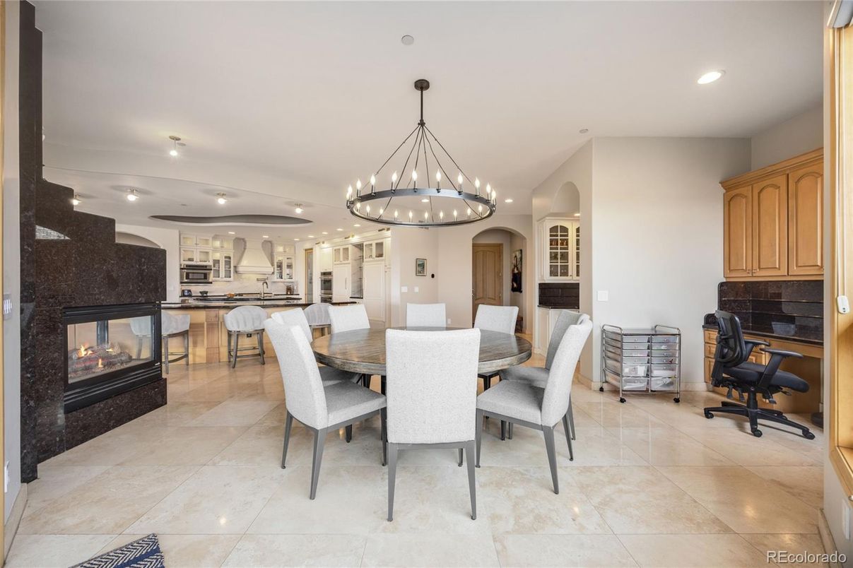 Chandelier, Dining room, Fireplace, Interior, Kitchen, Pendant Lights, Recessed Lighting, Stainless Steel Appliances